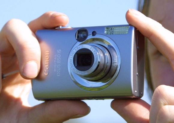 Picture of a woman holding a camera